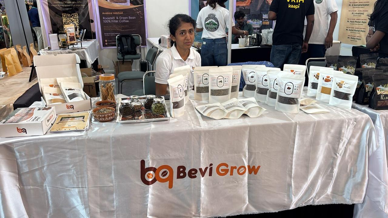 BeviGrow team presenting coffee and spice products at the festival stall